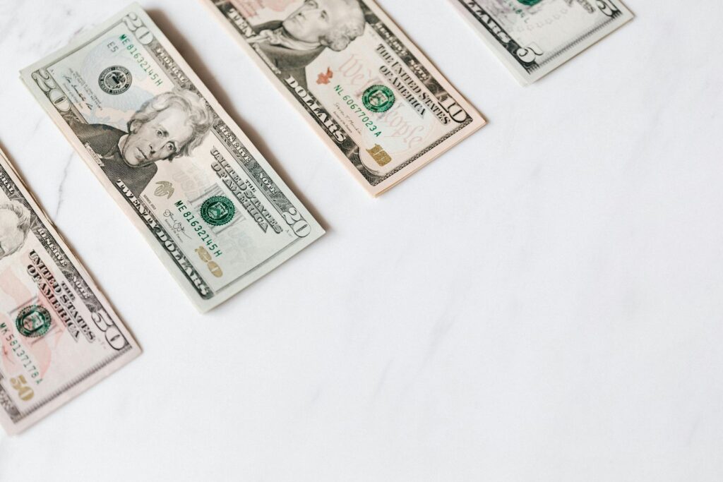 Set of various dollar banknotes on white table