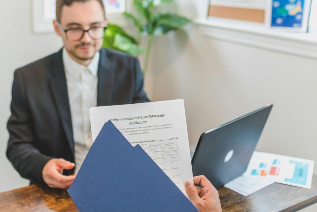 A Person Holding Loan Documents