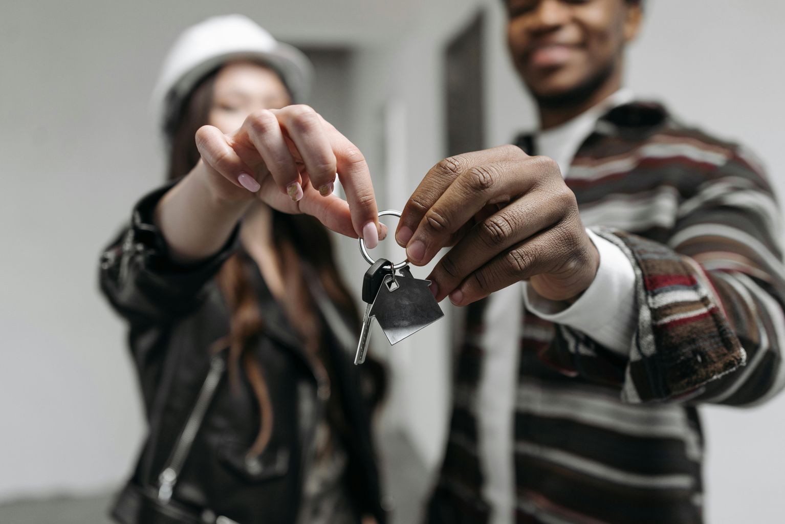 A Couple Holding their House Key